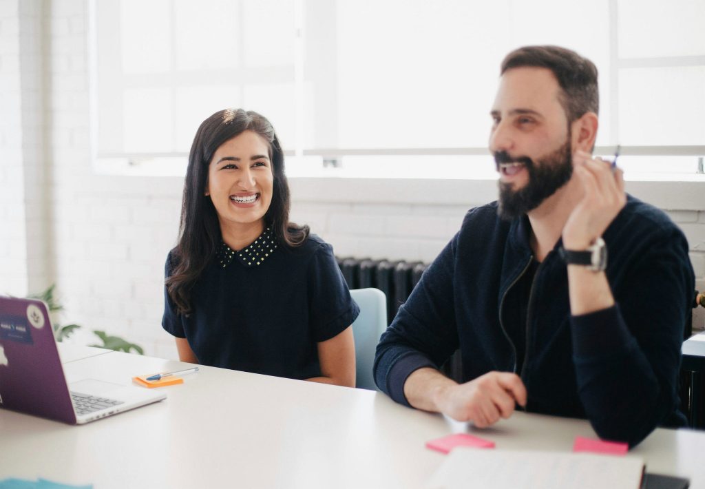 A photograph of happy people working together