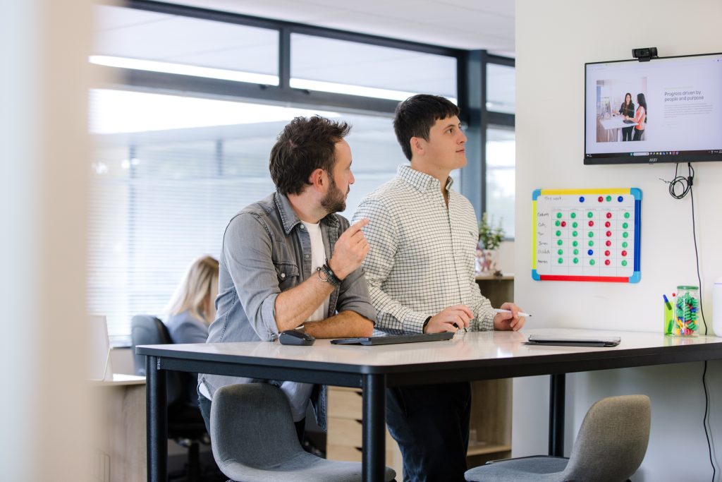 Two learning developers reviewing some content at the Like-Minded offices in Christchurch